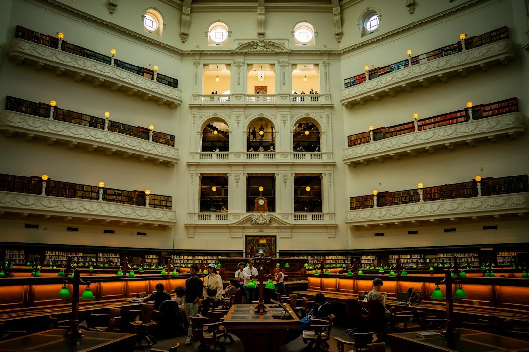 Students studying together in a library while preparing for higher education