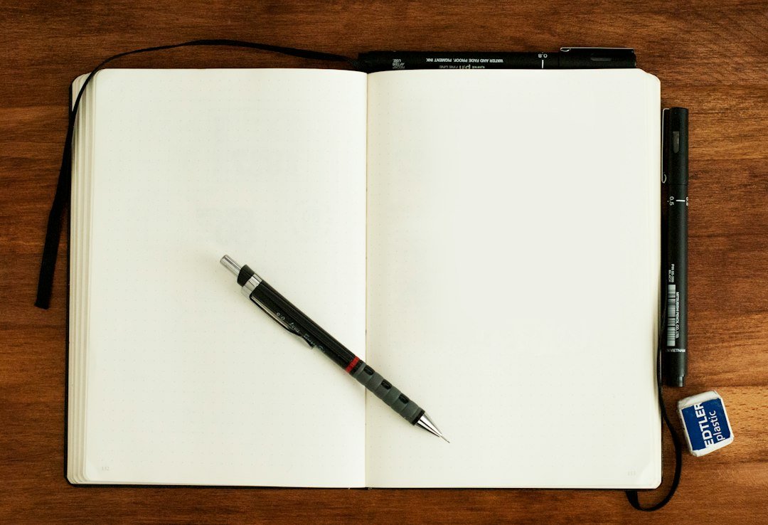 Open notebook and writing materials prepared for a study and revision session