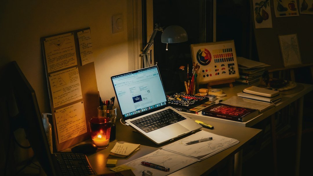 Study desk with laptop and books for students researching US scholarships